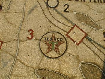 Faded Texaco logo in terazzo 