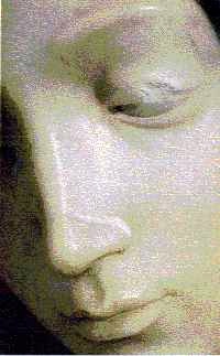 Pieta showing repaired nose, chipped eyelid